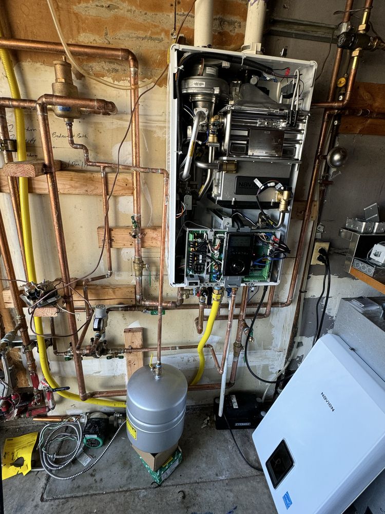 Licensed technician's tankless water heater installation with copper piping